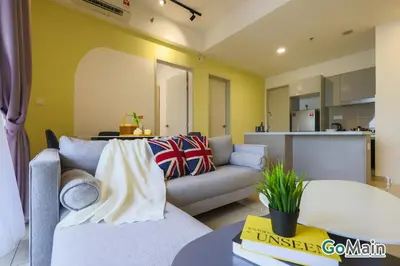 a living room with a couch and a kitchen at [4 Pax] Trion KL // Near Pavillion KL KLCC TRX in Kuala Lumpur