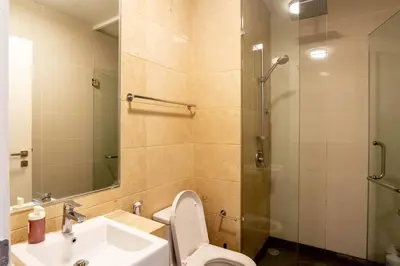a bathroom with a sink and a toilet and a shower at M City Residence by Airhost in Kuala Lumpur