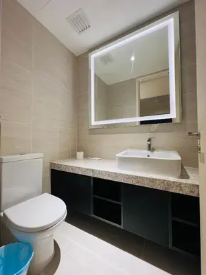 a bathroom with a white toilet and a sink at Star at KLCC By EAE in Kuala Lumpur