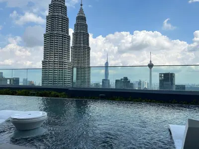 a swimming pool with a toilet in the middle of a city at Star at KLCC By EAE in Kuala Lumpur