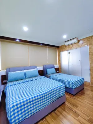 a room with two beds and a chalkboard at Nice Stay 16pax at Wisma Cosway Pavilion KLCC Bukit Bintang in Kuala Lumpur