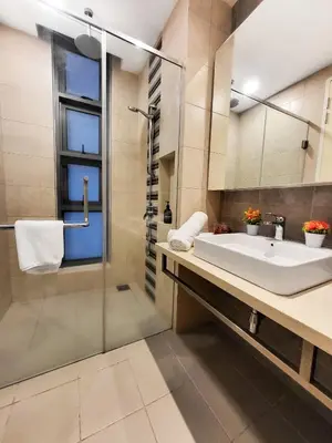 a bathroom with a sink and a shower at Robertson Residences in Kuala Lumpur