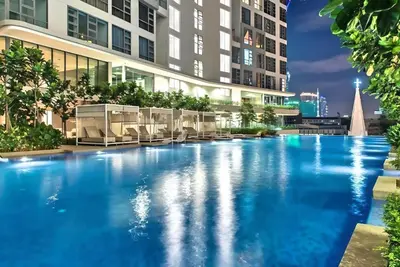a swimming pool in the middle of a building at Robertson Residences in Kuala Lumpur