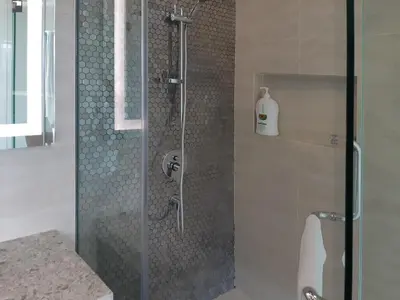 a shower with a glass door in a bathroom at KLCC Star Suites by BBA in Kuala Lumpur