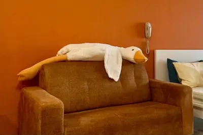 a stuffed duck is sitting on top of a chair at Continew by Xuan and Partner near KLCC and Bukit Bintang in Kuala Lumpur