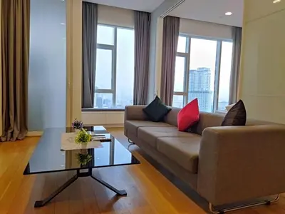 a living room with a couch and a table at The Platinum KLCC By Luxe Suites in Kuala Lumpur