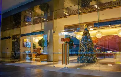 a christmas tree in the window of a store at The Platinum KLCC By Luxe Suites in Kuala Lumpur