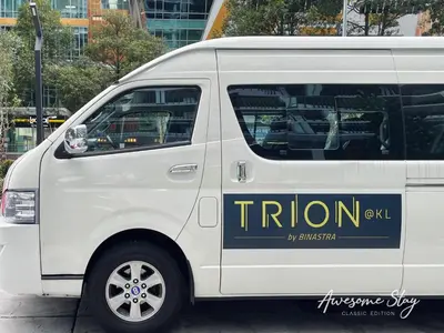 a white van with a sign on the side of it at Trion @ KL By The Relaxstay in Kuala Lumpur