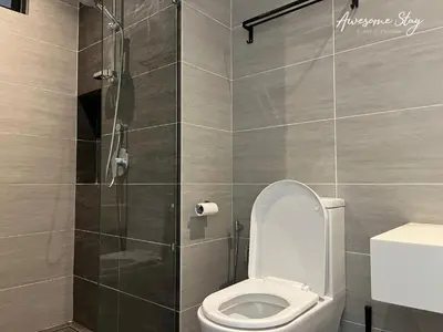 a bathroom with a toilet and a shower at Trion @ KL By The Relaxstay in Kuala Lumpur