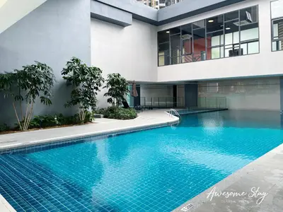 a swimming pool in front of a building at Sunway Velocity Two By Awesomestay in Kuala Lumpur