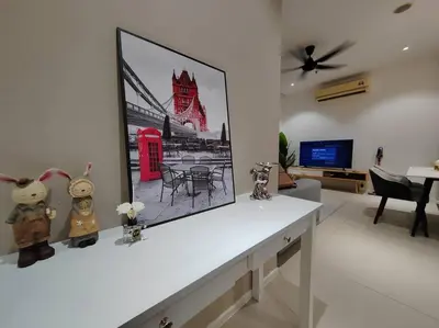 a living room with a picture of a red phone booth at Arcoris Mont Kiara 7# Main Street #Walking 1MK# 163 Retails# 2 BR Balcony 2-4Pax in Kuala Lumpur