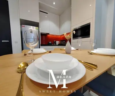 a table with a white plate and wine glasses on it at Arcoris Mont Kiara 19# Deluxe 1 Bedroom With Balcony KL #1-3Pax in Kuala Lumpur