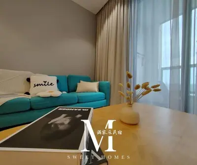 a living room with a blue couch and a table at Arcoris Mont Kiara 19# Deluxe 1 Bedroom With Balcony KL #1-3Pax in Kuala Lumpur