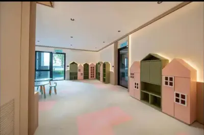 a large room with a play room with a toy house at scatletz suites klcc by yatie in Kuala Lumpur