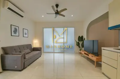 a living room with a couch and a tv at Maxhome Premium at Quill Residence KL City Centre in Kuala Lumpur