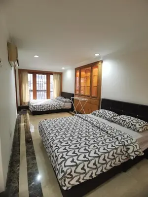 a large bedroom with two beds in it at Fahrenheit88 2minsPavilionKL TRX by Abby Stay in Kuala Lumpur