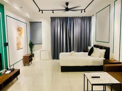 a bedroom with a bed and a tv in it at Chambers Residences ZFJ World in Kuala Lumpur