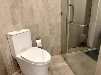 a bathroom with a toilet and a shower at Bintang Fairlane Residence, KLCC & City Skyline View -2B1R in Kuala Lumpur