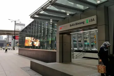 a building with people walking in front of it at Bintang Fairlane Residence, KLCC & City Skyline View -2B1R in Kuala Lumpur