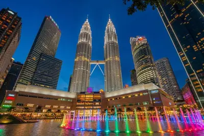 a view of the petronas towers at night at Bintang Fairlane Residence, KLCC & City Skyline View -2B1R in Kuala Lumpur