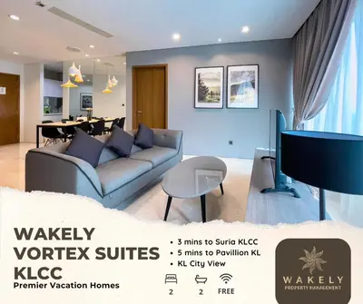 a living room with a couch and a tv at Vortex Suites KLCC by Wakely Kuala Lumpur in Kuala Lumpur
