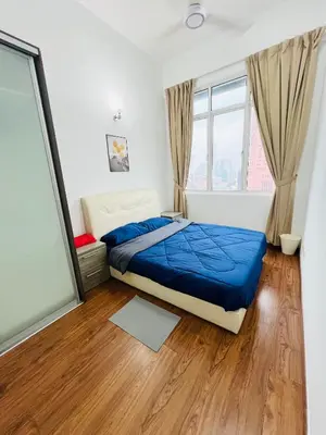 a bedroom with a bed and a large window at klcc view VUE residences Hkl 2 in Kuala Lumpur