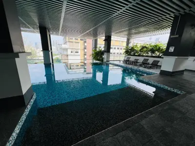 a swimming pool in the middle of a building at klcc view VUE residences Hkl 2 in Kuala Lumpur