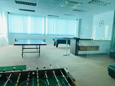 a room with a ping pong table and ping pong balls at klcc view VUE residences Hkl 2 in Kuala Lumpur