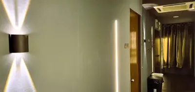 a room with a hallway with a light on the wall at Guesthouse@ Bukit Bintang in Kuala Lumpur