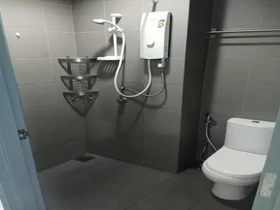 a bathroom with a shower with a toilet at Diamond Suite KL at Mercu Summer Suite KLCC in Kuala Lumpur