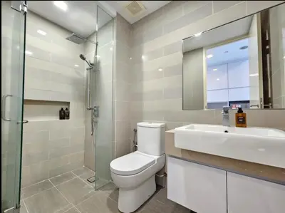 a bathroom with a toilet and a sink and a shower at KL City Suites 2-4pax near KLCC & Bukit Bintang in Kuala Lumpur