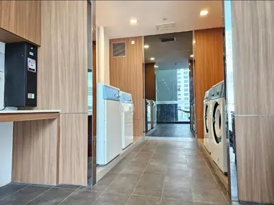 a laundry room with a washer and dryer at KL City Suites 2-4pax near KLCC & Bukit Bintang in Kuala Lumpur