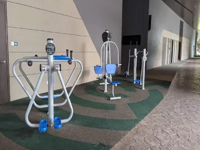 a row of exercise equipment in a building at Axon Residence Kuala Lumpur Pavilion in Kuala Lumpur