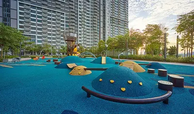 a park with a playground in a city at M Vertica KL City in Kuala Lumpur