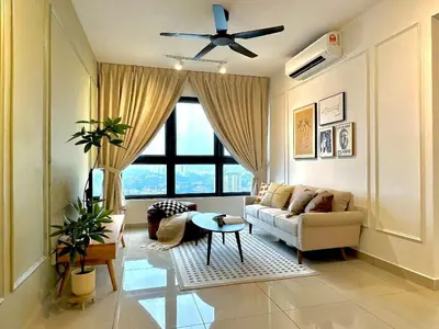 a living room with a couch and a ceiling fan at M Vertica KL City in Kuala Lumpur
