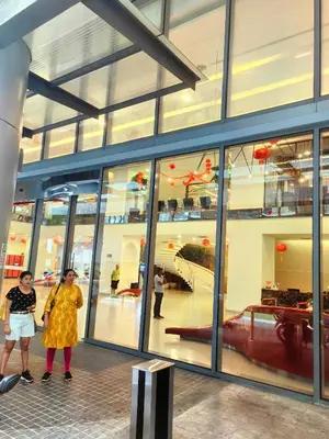 two people standing in front of a store window at Summer Suites KLCC By Palace in Kuala Lumpur