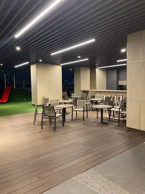 a dining area with tables and chairs in a building at Infinite Pool! Room in Kuala Lumpur in Kuala Lumpur