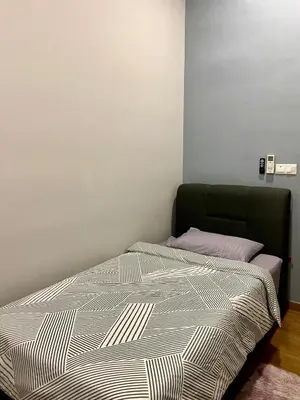 a bed sitting in a room with at Infinite Pool! Room in Kuala Lumpur in Kuala Lumpur
