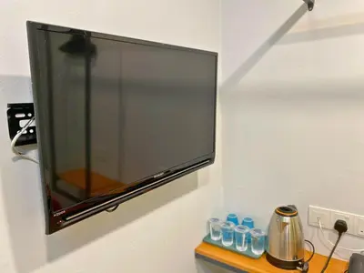 a flat screen tv hanging on a wall at Seeds Hotel Setia Wangsa in Kuala Lumpur