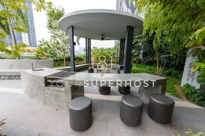 a sign for the future supremeost in a garden at Trion@KL by YourSuperhost in Kuala Lumpur