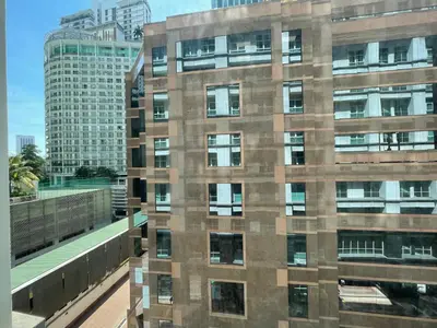 a tall brick building with windows in a city at Studio, 6 Pax, 3mins to KLCC (3A01_2) in Kuala Lumpur