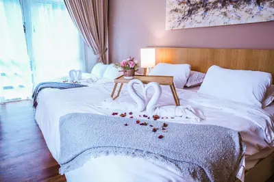 a bed with two hearts shaped towels on it at Studio, 6 Pax, 3mins to KLCC (3A01_2) in Kuala Lumpur