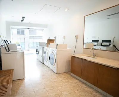 a laundry room with washing machines and a mirror at Studio, 6 Pax, 3mins to KLCC (3A01_2) in Kuala Lumpur