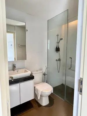 a bathroom with a toilet and a sink and a shower at The EST Bangsar Kuala Lumpur in Kuala Lumpur