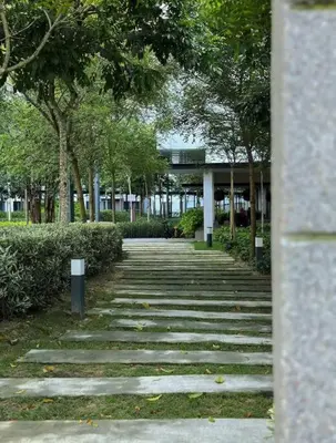 a stone path with trees and a building in the background at MVD19#Family Suite 8pax 3 Rooms M Vertica Velocity Mall Cheras IKEA Mytown Short Walk to MRT & LRT Maluri in Kuala Lumpur