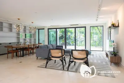 a living room with a couch and chairs and a table at Damansara Heights by Plush in Kuala Lumpur