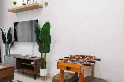 a living room with a chess game on a table at Sentul Homestay 3 Bedroom in Kuala Lumpur
