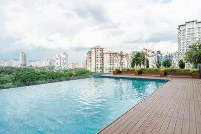 a swimming pool on the roof of a building with buildings at Sentul Homestay 3 Bedroom in Kuala Lumpur