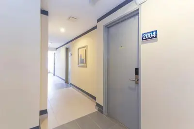 a hallway with a door with a exit sign on it at M HOTEL - Medan Tuanku Near MARA in Kuala Lumpur
