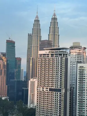 a group of tall buildings in a city at Soho Suites KLCC 20 jalan perak in Kuala Lumpur